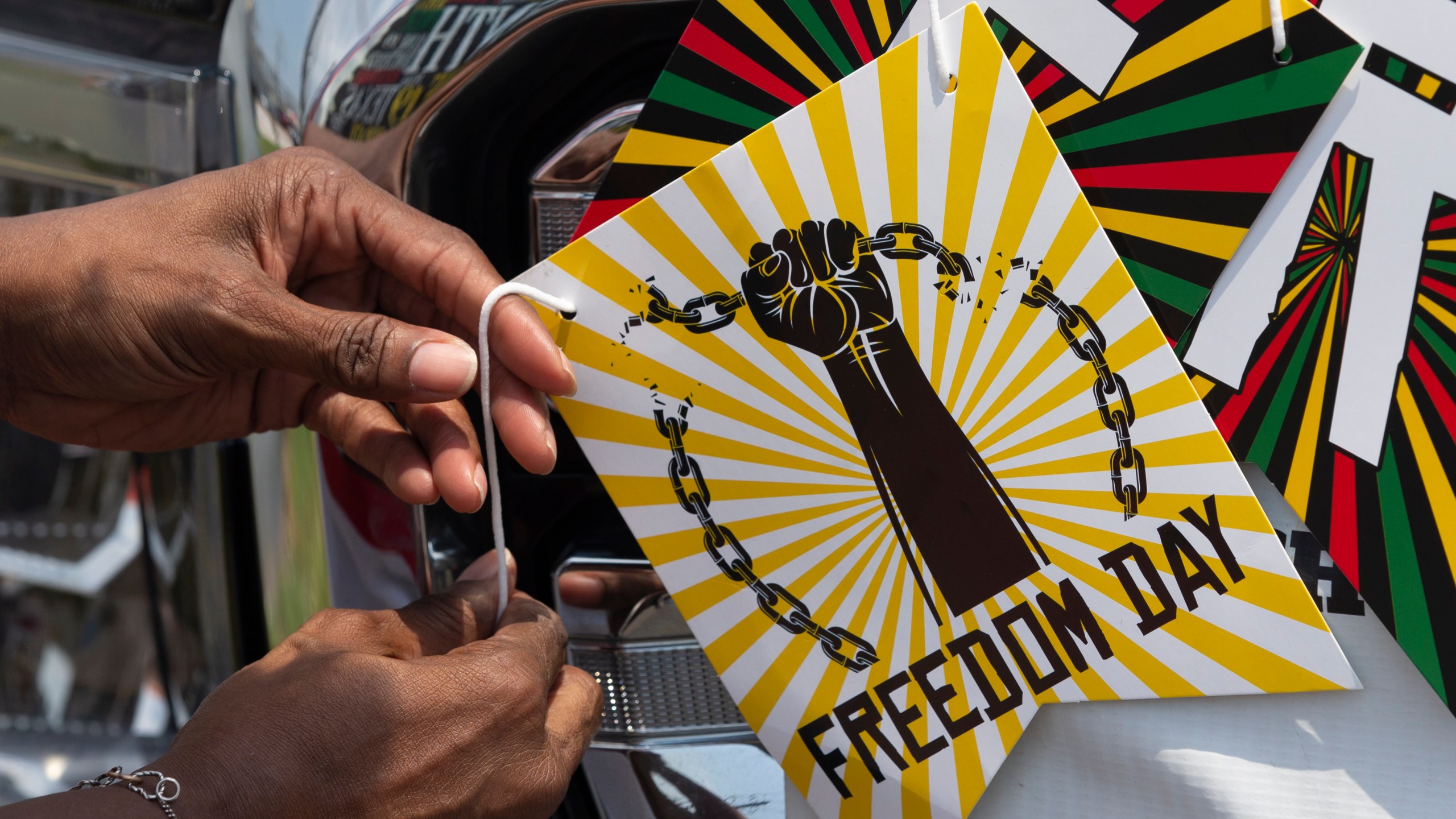 Florence Bell decorates her truck for the annual Galveston Juneteenth Parade in Galveston, Texas, on Saturday, June 17, 2023. (Stuart Villanueva/The Galveston County Daily News via AP)