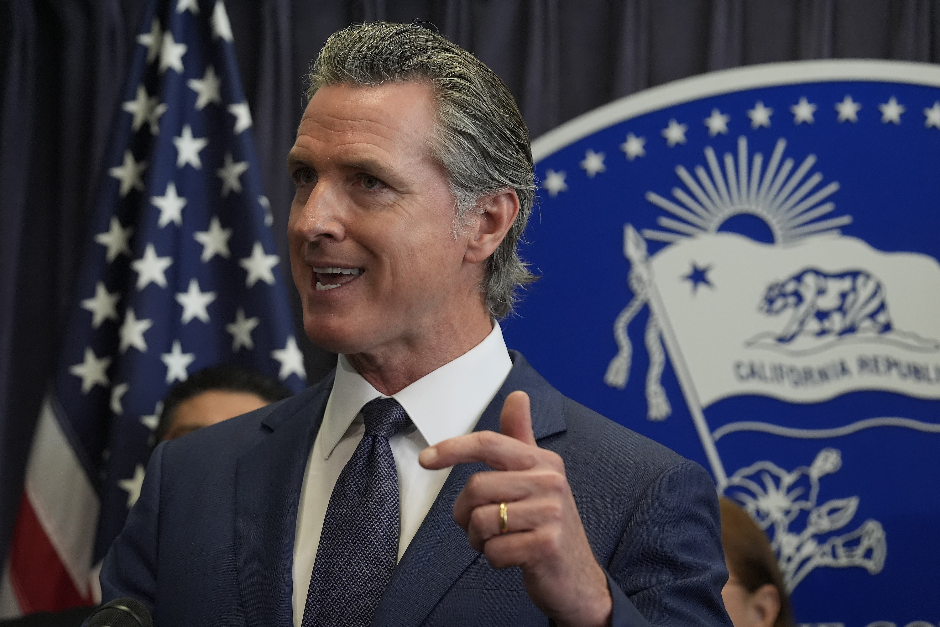 FILE - California Gov. Gavin Newsom during a news conference, March 21, 2024, in Los Angeles. California announced Thursday, May 9, 2024, it is partnering with five companies to develop generative AI tools to help deliver public services. (AP Photo/Damian Dovarganes, File)