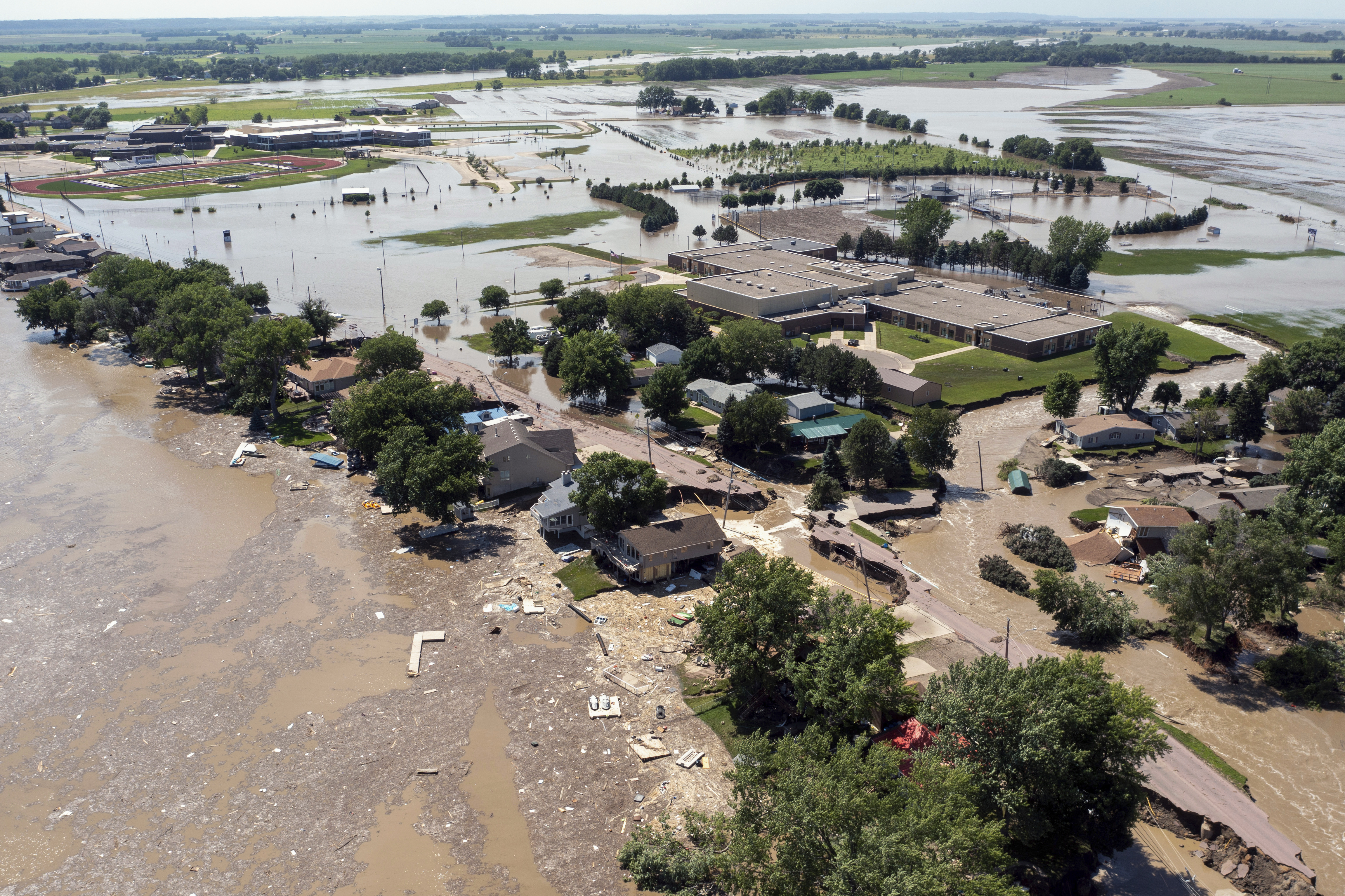 Flooding from the Big Sioux River damages roads and buildings in North Sioux City, S.D., on Monday, June 24, 2024. (AP Photo/Josh Jurgens)